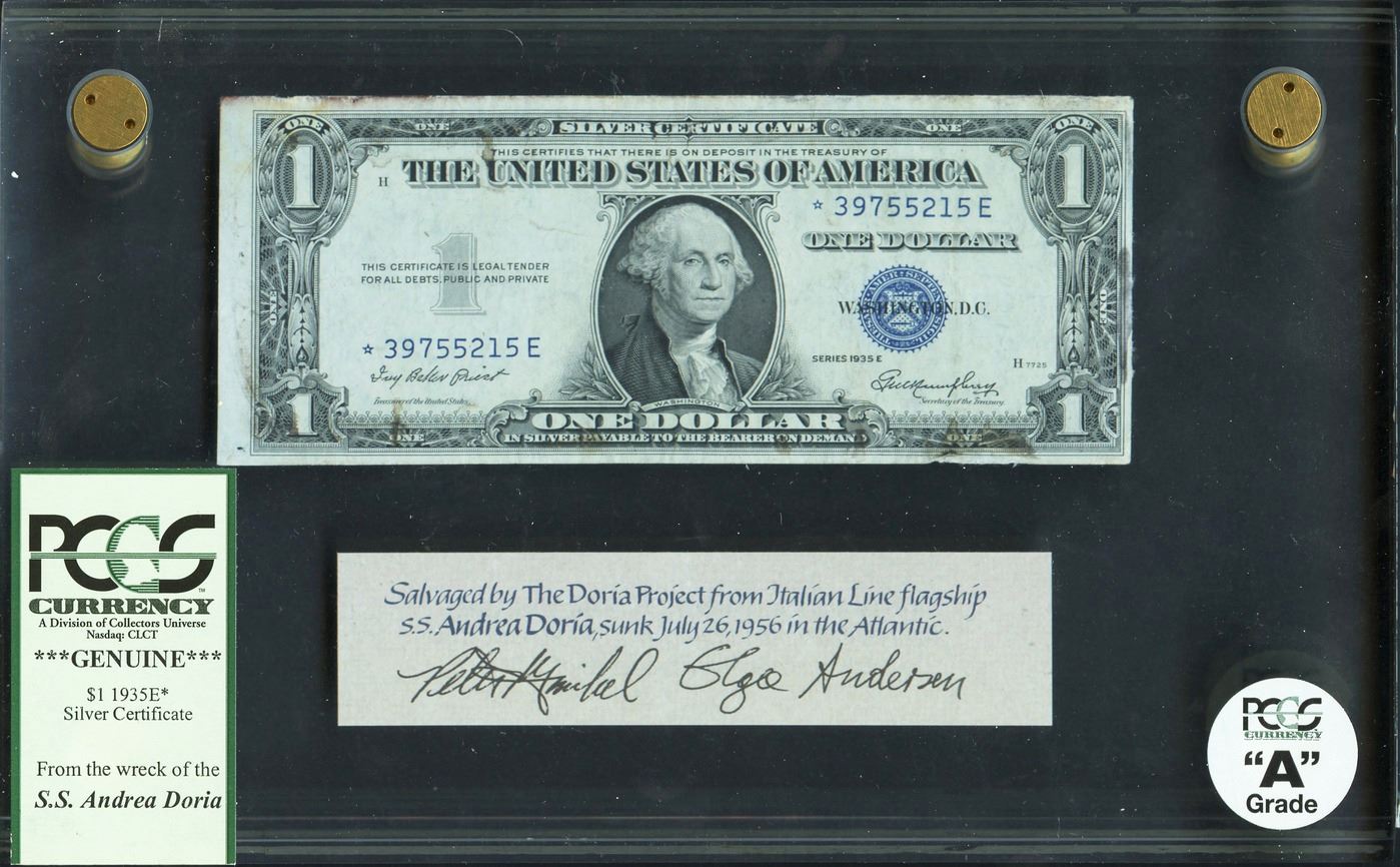 Memoria numismatica di un naufragio: uno dei dollari recuperati dalla cassaforte della "Andrea Doria" naufragata nell'Altantico nel 1956