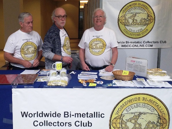Il tavolo del WBCC ad una delle edizioni della World Money Fair: Martin Peeters, come sempre sorridente, è quello a destra