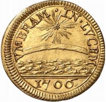 Il dritto della "moneta rebus" di papa Albani con gli elementi posti "in capo" allo stemma del pontefice